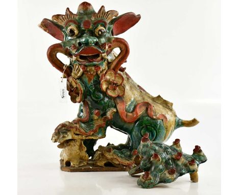 A large Chinese ceramic model of a Dog of Fo, originally a finial for a rooftop, height 49cm (af).Provenance: Dreweatts, 17th