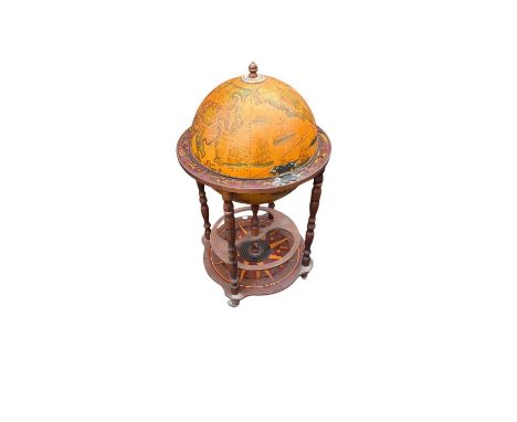 A reproduction globe drinks cabinet with assorted decorative glassware.