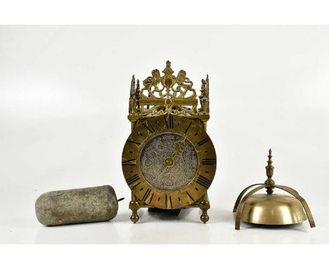 An early 20th century brass lantern clock, with brass chapter ring set with Roman numerals, height 29cm.Condition Report: In 