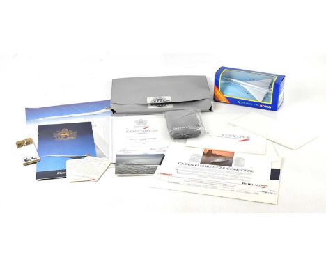 A collection of Concorde memorabilia including postcard, inflight entertainment guide, drinks menu, flight certificate, summe