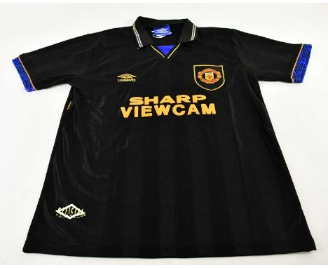 ERIC CANTONA; a Manchester United retro style 'Kung-Fu Kick' football shirt, signed verso, size L.Condition Report: Light cre