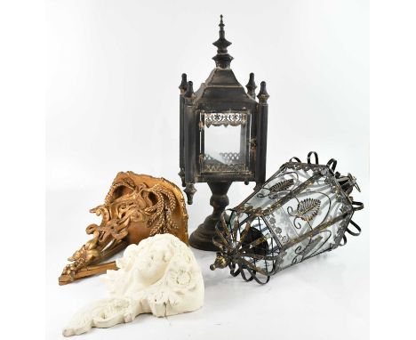 A modern decorative hexagonal street type hanging lantern, a modern freestanding candle holder and two brackets including an 