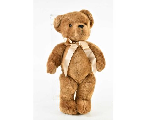 MERRYTHOUGHT; a brown fur bear with bow, 55cm.