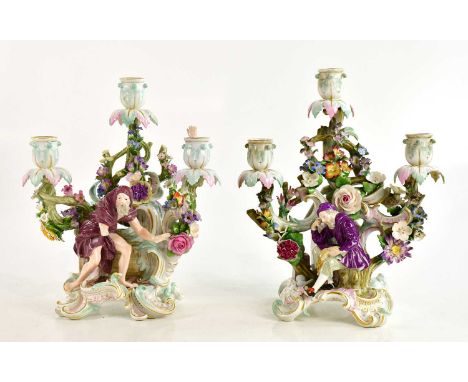 MEISSEN; a pair of candelabra with floral encrusted decoration, height 30cm (2).Condition Report: One of the pairs has had it