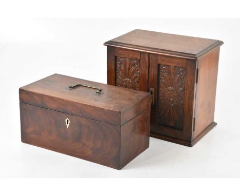 A 19th century mahogany tea caddy, the hinged cover enclosing fitted compartment, width 31cm, and a carved oak smoker's cabin