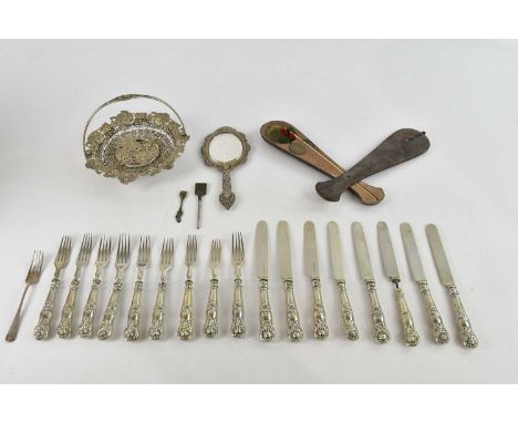 An Eastern white metal filigree decorated hand mirror, a hallmarked silver fork, assorted silver plated flatware, an unusual 