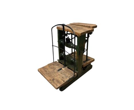 A set of cast metal and hardwood antique balance scales, height 89cm, width 86cm.