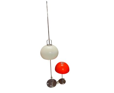 IN THE MANNER OF HARVEY GUZZINI; a vintage table lamp with orange shade, height 51cm, and a similar chrome standard lamp with