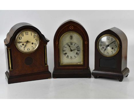 An Edwardian inlaid mahogany lancet top mantel clock, with silvered dial, height 41cm, and two further mantel clocks (3).