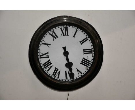 A 20th century enamel wall clock, the dial set with Roman numerals, with electric movement, diameter 70cm.Provenance: Purport