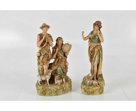 ROYAL DUX; a figure group representing a shepherd and shepherdess, playing pipes and tambourine, height 28cm, and a further R