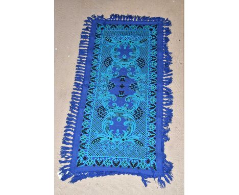 A vintage Casa Pupo rug, with stylised decoration on a turquoise and deep blue ground, approx 214 x 95cm.
