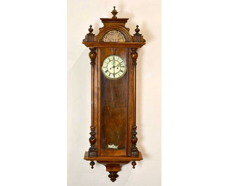 A late 19th/early 20th century mahogany cased Vienna style wall clock, with white enamel dial set with Roman numerals and sub