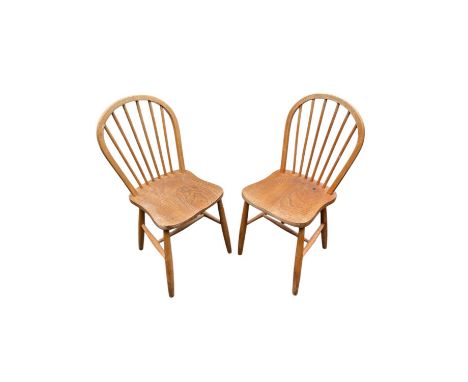 ERCOL; a pair of stick back chairs. 