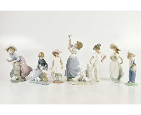 NAO; eight figures including young lady playing with rabbit, young girl releasing dove, geese etc, height of largest 23cm (8)