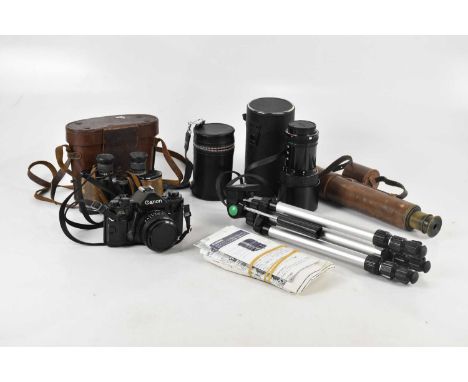 CANON; an A1 camera, also a collection of vintage lenses and equipment, a cased pair of binoculars and a three draw telescope