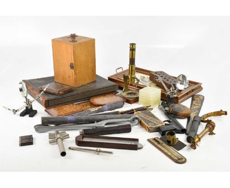 An assortment of collectors' items including walnut bookslide, microscope, a piece of the old Britannia with hallmarked silve
