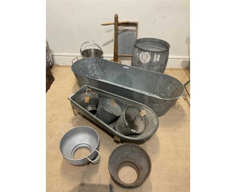 A collection of vintage galvanised metalware including dolly tub with wash board and dolly, an oval bath, length 140cm, steel