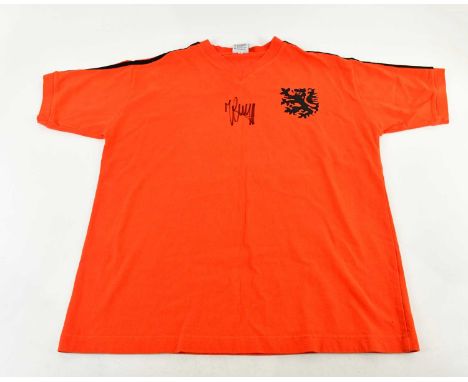 JOHAN CRUYFF; a Netherlands retro style football shirt, signed to front, size L.Condition Report: Light creasing and fading, 