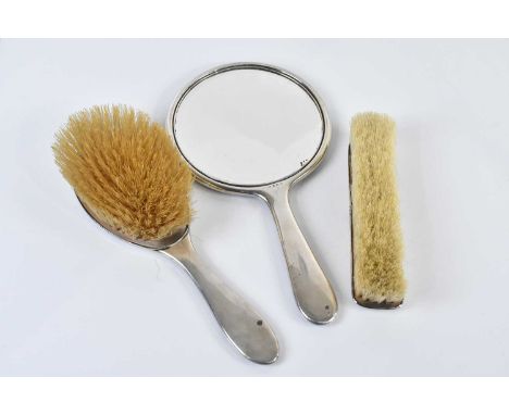 W G SOTHERS LTD; a George V hallmarked silver and blue enamel three piece dressing table set, Birmingham 1927.