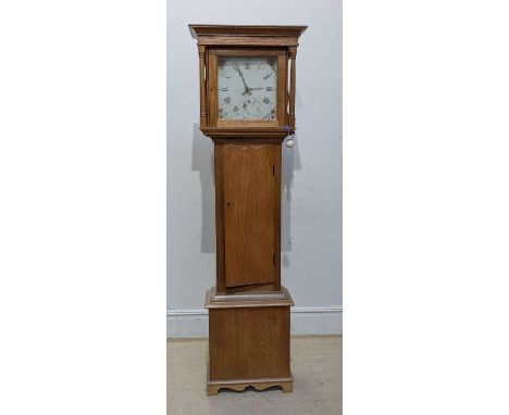 A light oak cased longcase clock, the associated painted dial set with Roman numerals, height 201cm.