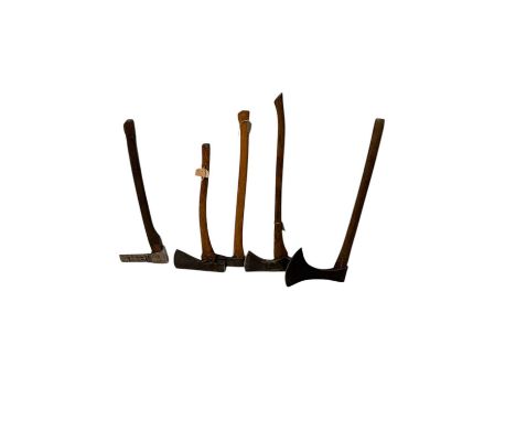 Five vintage axes, including a Whitehouse Bros miner's axe, the blade stamped 'Tygwyn Twyall', height 68cm.