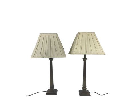 A pair of modern brass table lamps, with square columns and stepped bases, pleated shades, height without shades 40cm, with t