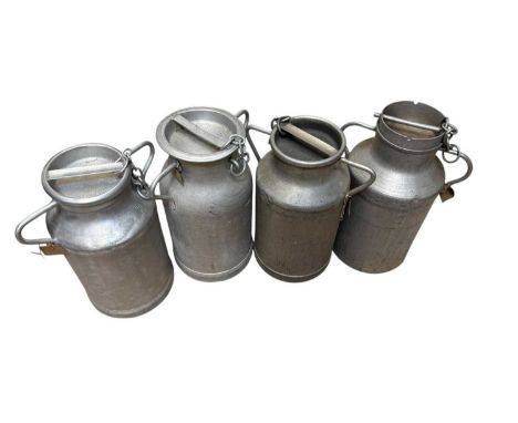 Four vintage twin handled galvenised milk churns and covers, largest approx 51cm.