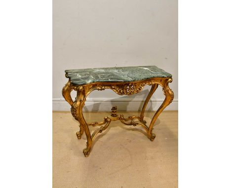 A gilt wood serpentine fronted marble top console table, width 90cm, with associated gilt framed triptych mirror.