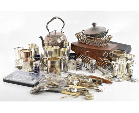 An assortment of silver plated and other metal items, to include a kettle with scrolling decoration, flatware, a cased set of