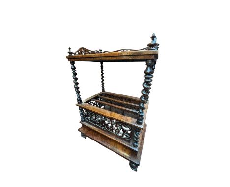 A Victorian walnut whatnot, with carved raised back on bobbin columns, with three divisions and single base drawer, width 58c