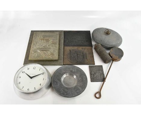 An assortment of metalware including a longcase clock pendulum, pewter plate marked 'Reinzinn', relief decorated with animals