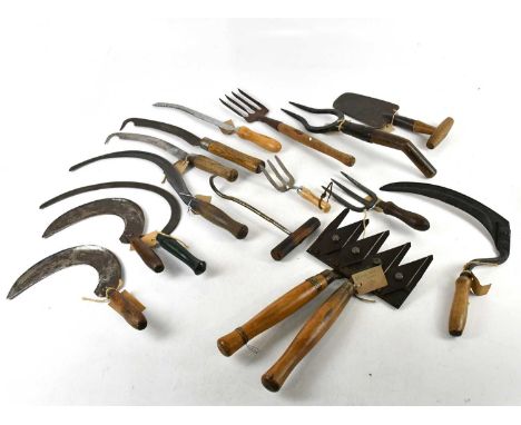 A collection of vintage farming/gardening tools including asparagus knife, early 20th century strawberry spade, The Astor She