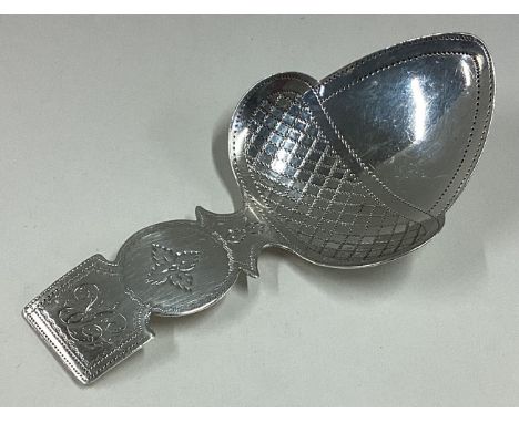 A good Georgian silver caddy spoon in the form of an acorn with engraved decoration. London. By EM. Approx. 8 grams. Est. £50