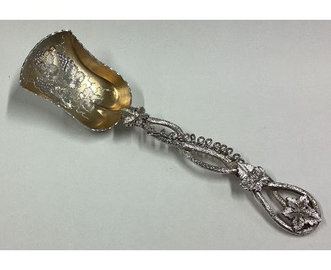 A fine Victorian silver caddy scoop with vine decoration. London. By C&S. Approx. 25 grams. Est. £50 - £80.