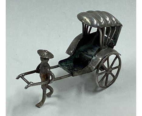 A Chinese export silver toy rickshaw. Marked 90 to reverse. Approx. 10 grams. Est. £20 - £30.