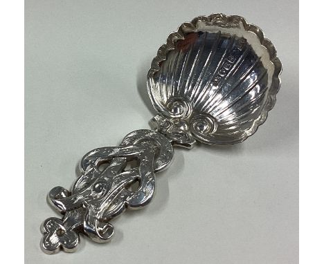 An attractive chased Victorian silver caddy spoon with fluted bowl. Birmingham. By FC. Approx. 10 grams. Est. £40 - £60.