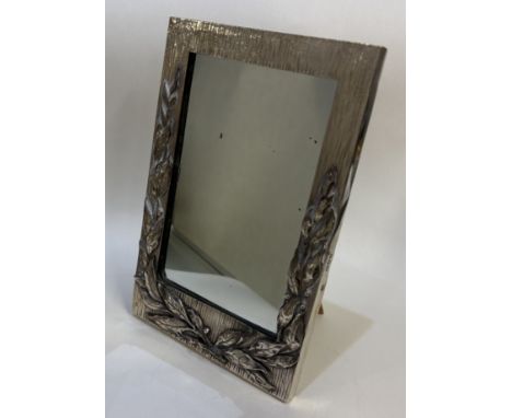 A silver mounted easel mirror with leaf decoration and bark finish. London 1895. By William Gibson & John Lawrence Langman. E