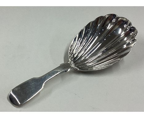 A George III silver caddy spoon of fluted design. London 1830. Approx. 12 grams. Est. £30 - £40.