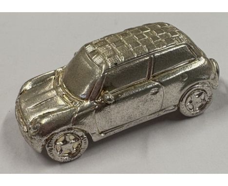 A heavy Sterling silver toy model of a car. Approx. 21 grams. Est. £20 - £30.