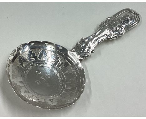 An attractive silver caddy spoon with bright-cut decoration. Birmingham. By IB. Approx. 7 grams. Est. £40 - £60.