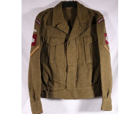 Army uniform battle dress khaki green jacket by Tip Top Tailers Ltd dated to interior 1951 with Parachute Regiment cloth badg