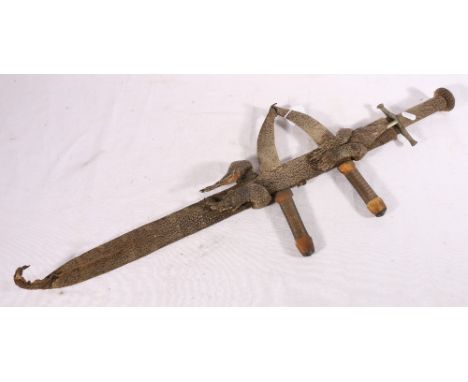 Sudanese kaskara type sword with cross bar hilt and lizard skin grip, the scabbard bound with the skin of a lizard with two f