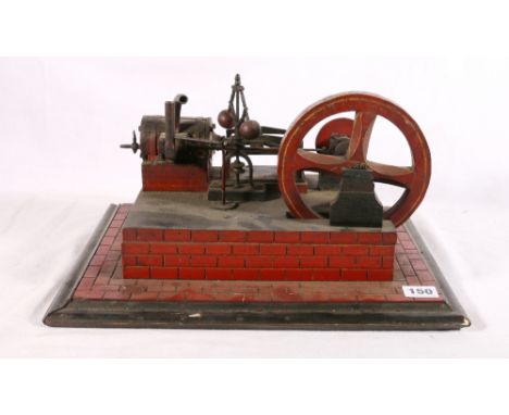 Single crank platform model engine raised on simulated brick base, 38cm wide 