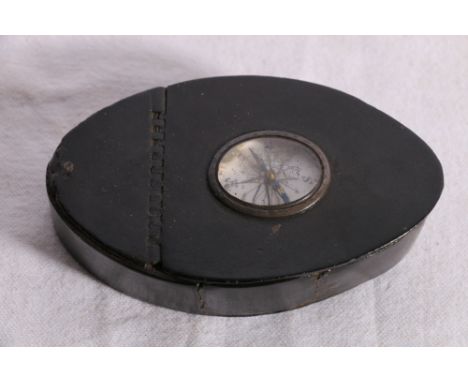 Leather snuff box with compass set to the cover, note inside reads "This curious old snuff box of leather, with compass in li