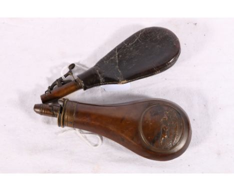 Dixon and Son patent powder flask decorated with gun dogs and a leather powder flask 