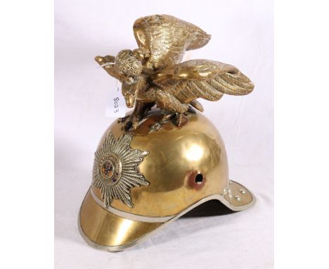 Russian Imperial Garde brass helmet having star plate with enamel centre and double eagle crest finial 