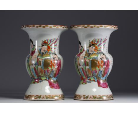 China - A pair of famille rose porcelain vases decorated with dignitaries, courtesans and poems, 19th century. Normal wear - 