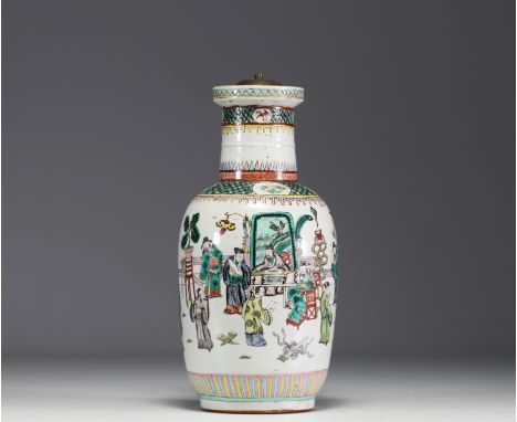 China - A green family polychrome porcelain vase (mounted as a lamp) decorated with dignitaries, 19th century. Slight cooking