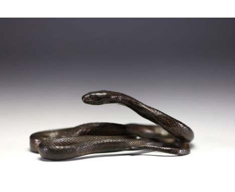 Sculpture in patinated metal representing a snake.Charity sale of the Rotary Club Liege Cite Ardente - La Crankelle. at first
